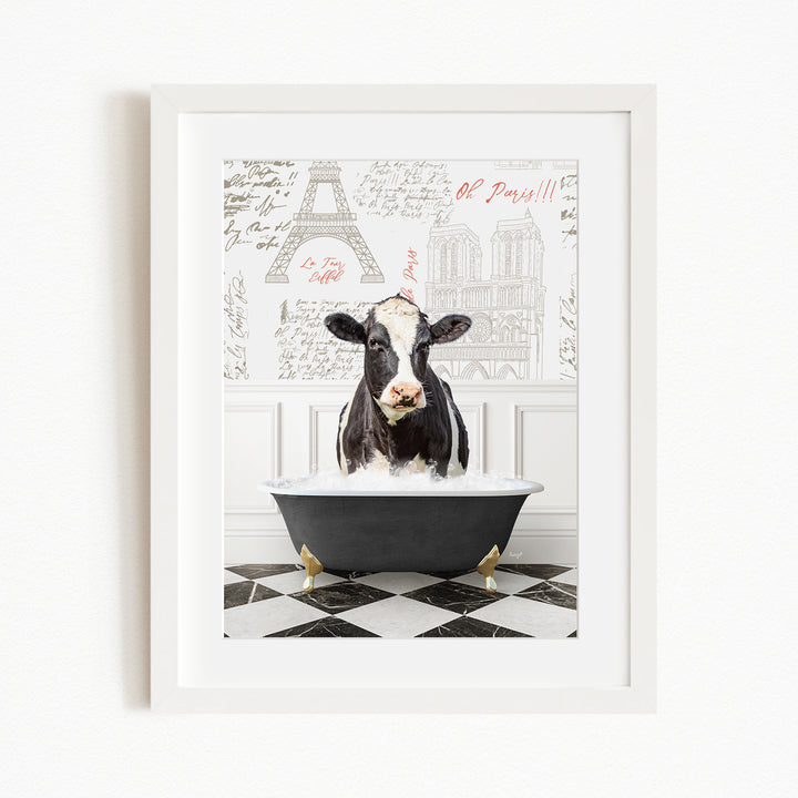 A black and white cow is sitting in a bathtub filled with water, surrounded by a checkered floor and a wall with the Eiffel Tower and other Parisian landmarks.