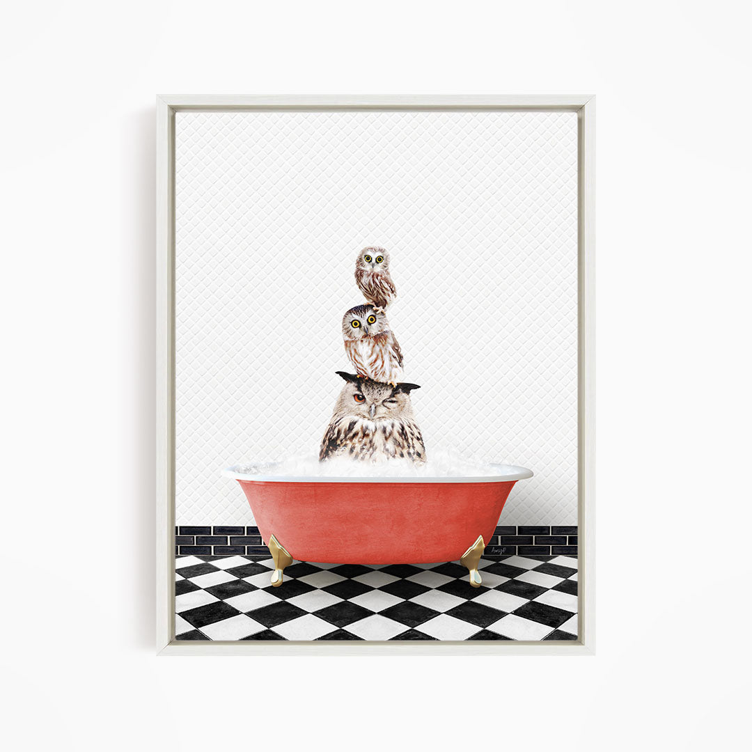 A framed image depicting a group of owls sitting in a red bathtub, with a black and white checkered floor beneath them.