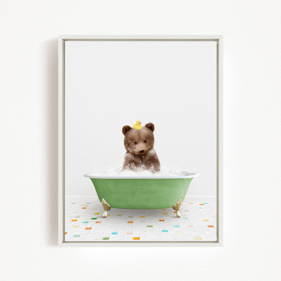 A brown bear sitting in a green bathtub filled with water, with a rubber duck floating on its head.