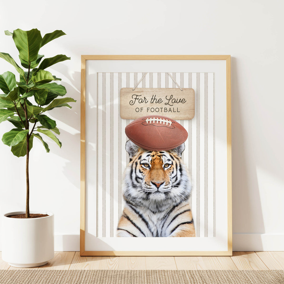 A framed poster featuring a tiger wearing a football helmet, with the text "For the Love of Football" written on it.