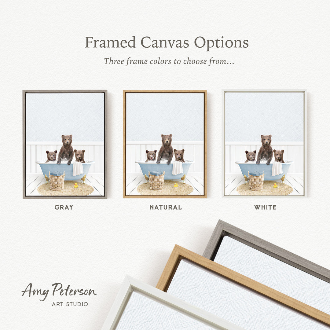three framed canvas options, each featuring a bear sitting in a bathtub. The options include a gray frame, a natural frame, and a white frame. The bears are brown and appear to be sitting in the bathtub, which is placed on a rug. The text above the image reads " Framed Canvas Options" and "Three frame colors to choose from...".
