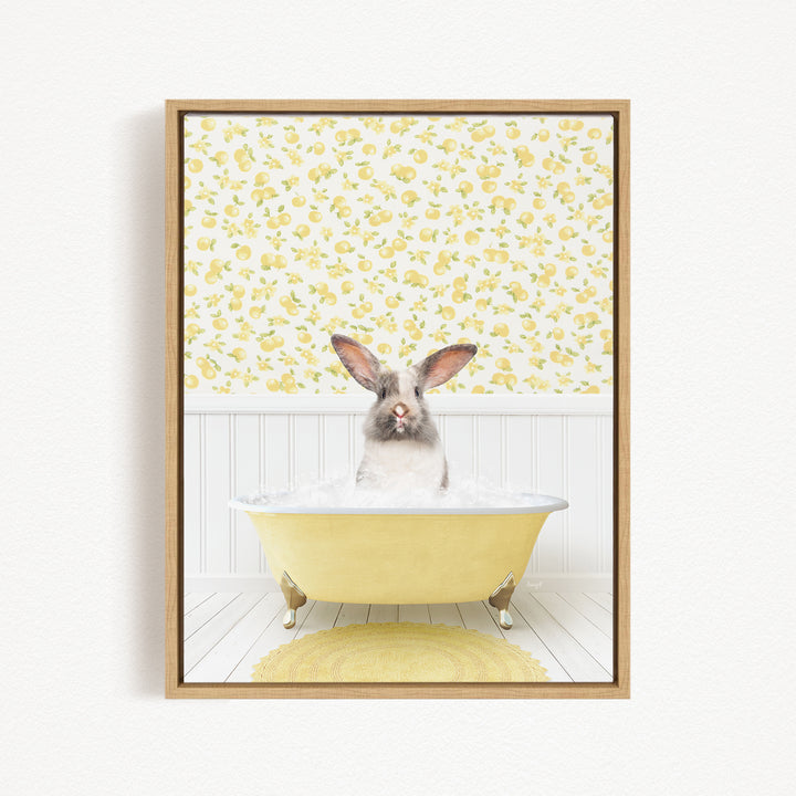 A rabbit sitting in a yellow bathtub filled with water, surrounded by a yellow floral pattern on the wall behind it.