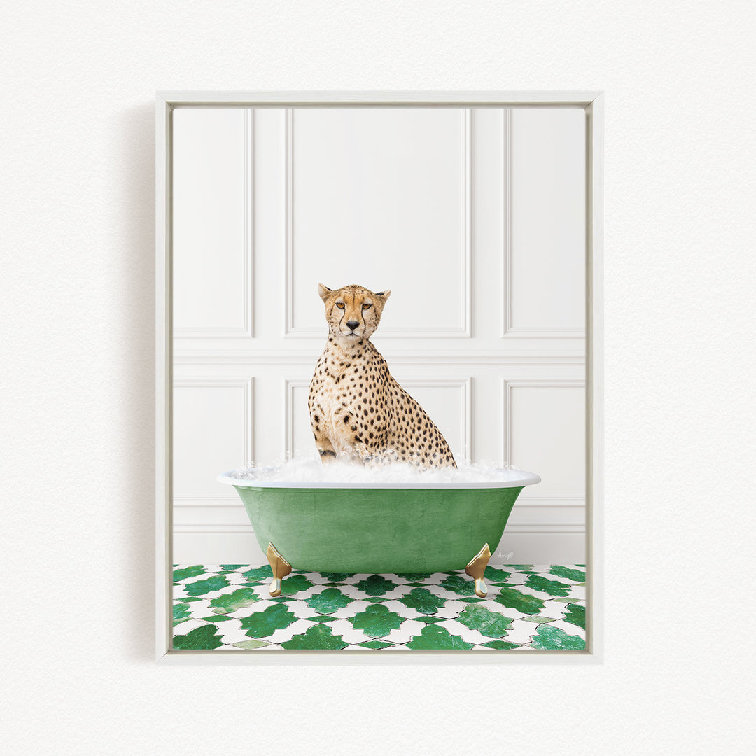 A cheetah sitting in a green bathtub filled with water, with a patterned green and white rug on the floor.