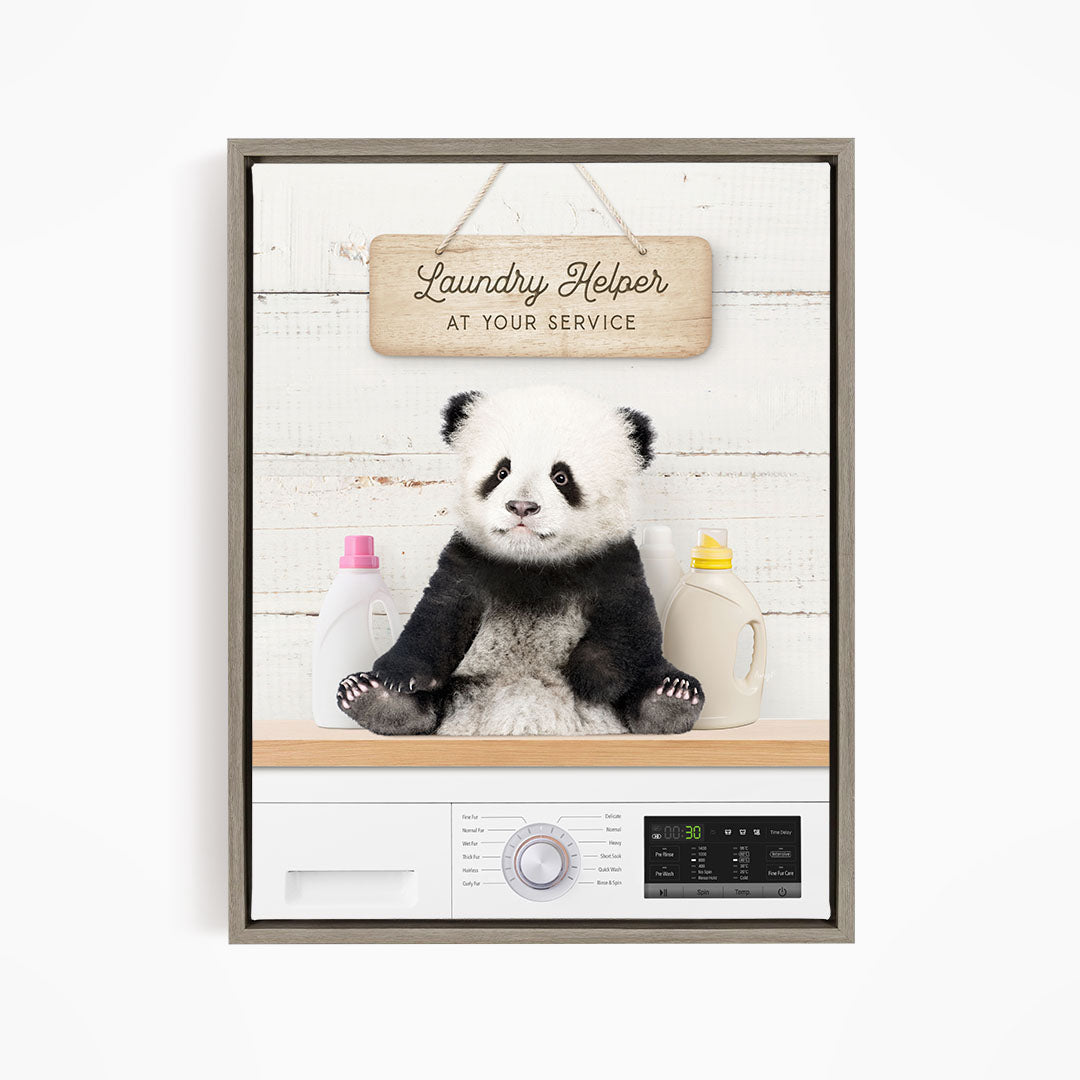 A panda bear sitting on a shelf next to a laundry machine, with a sign that says "Laundry Helper at your service".