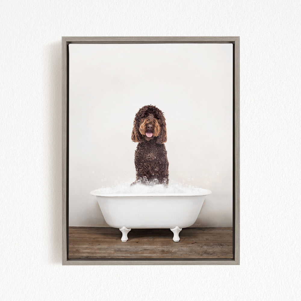A brown dog standing in a white bathtub filled with water, with bubbles around it.