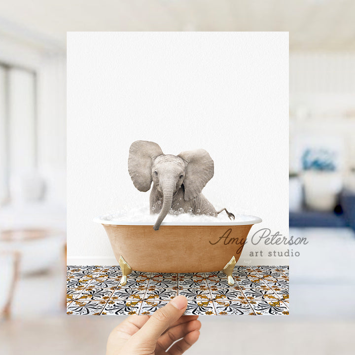 a hand holding a card with an elephant in a bathtub