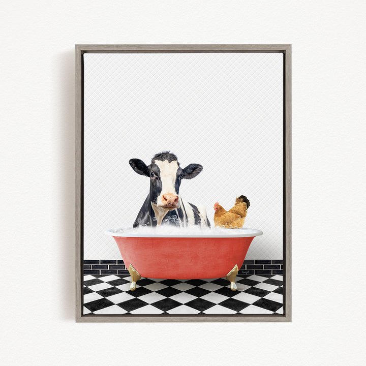 A black and white cow is sitting in a red bathtub, with a chicken standing on its hind legs next to it, both appearing to enjoy the bath together.