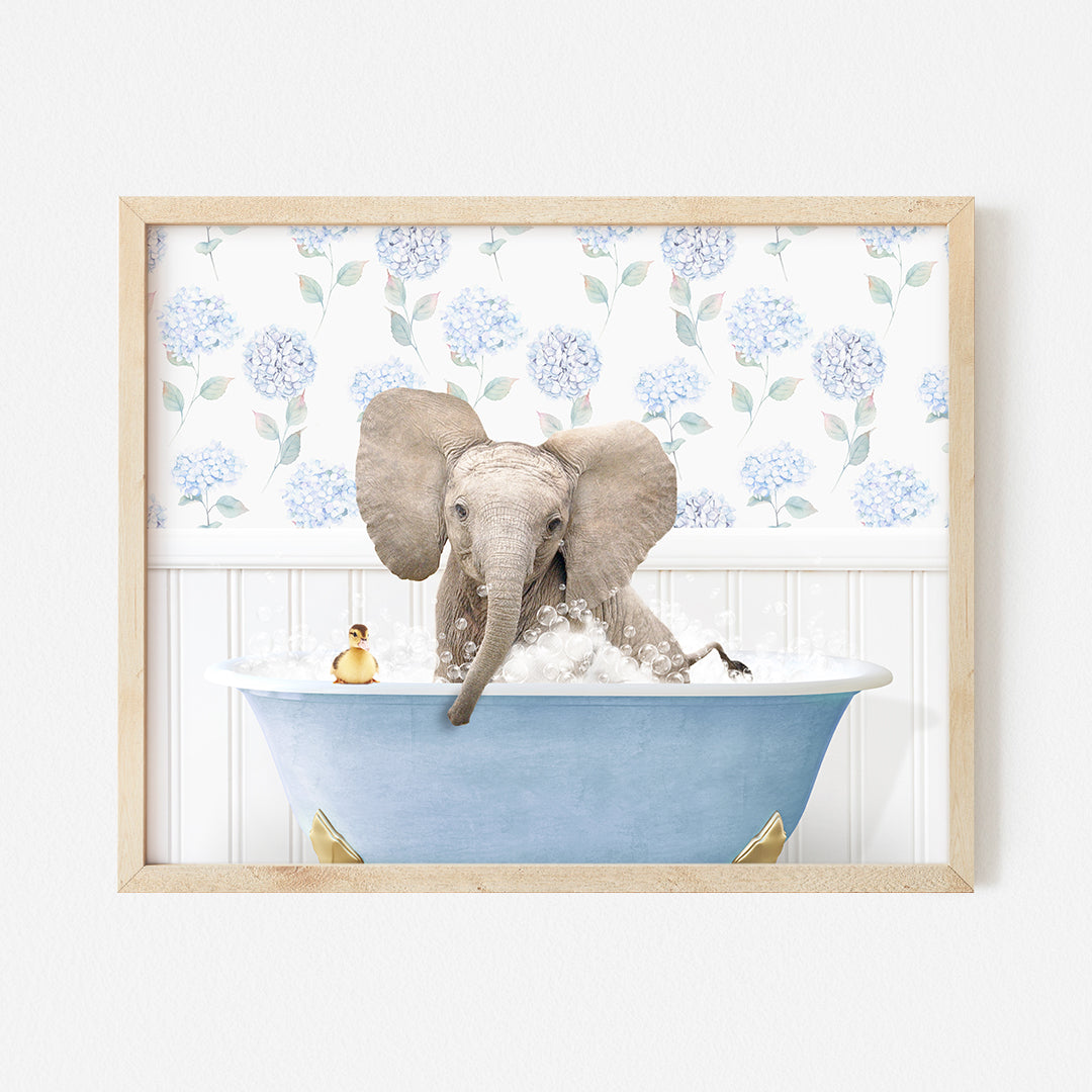 an elephant taking a bath in a blue bathtub