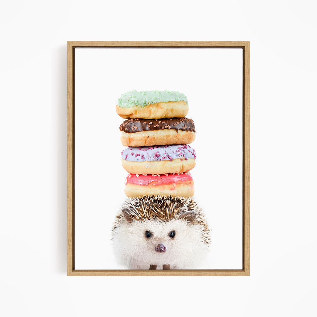 A hedgehog is sitting in front of a stack of colorful donuts, with the donuts piled on top of the hedgehog.