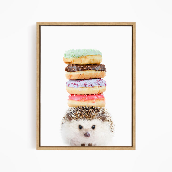 A hedgehog is sitting in front of a stack of colorful donuts, with the donuts piled on top of the hedgehog.