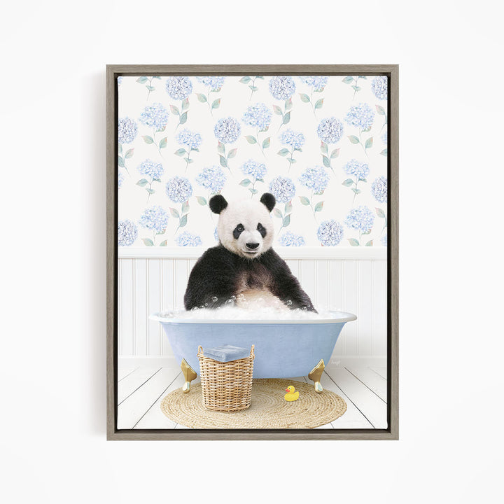 A panda bear sitting in a blue bathtub filled with bubbles, surrounded by a wicker basket and yellow rubber ducks.