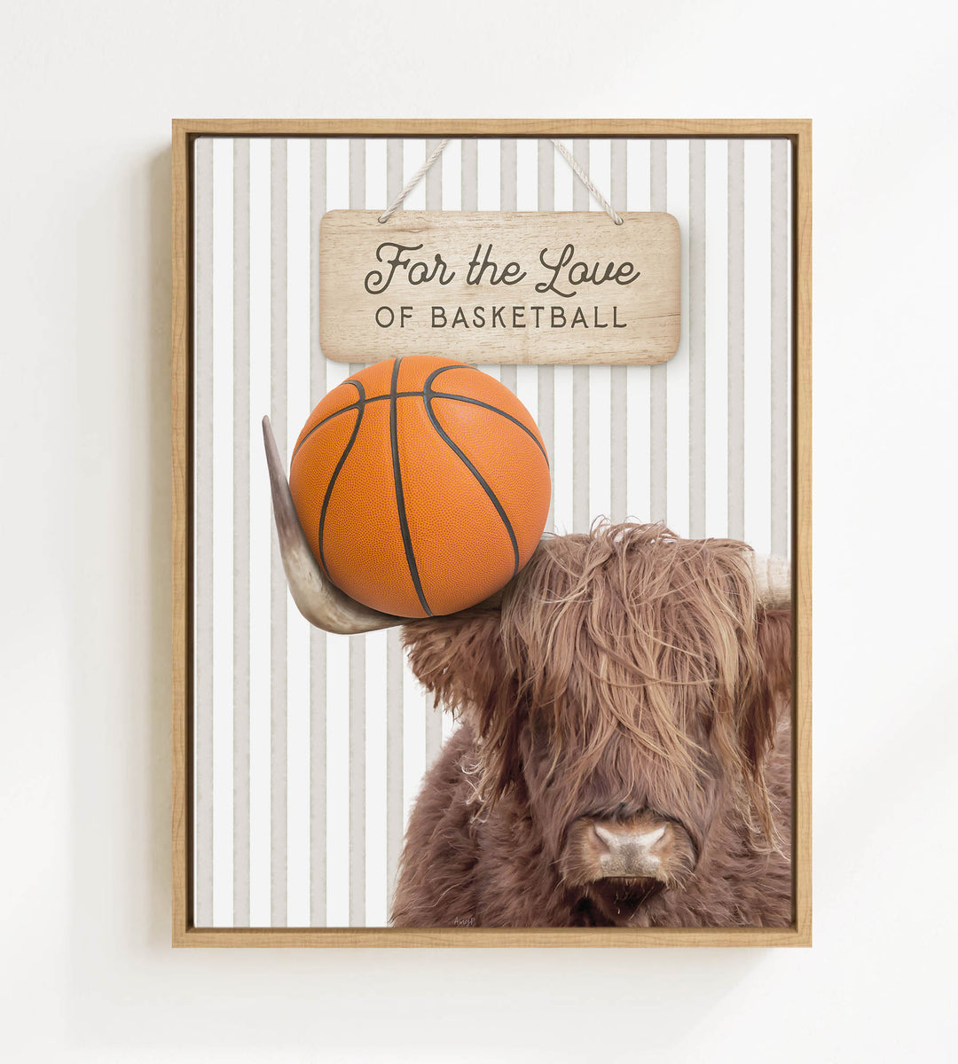 A framed image featuring a Highland cow holding a basketball, with a sign above that says "For the Love of Basketball".