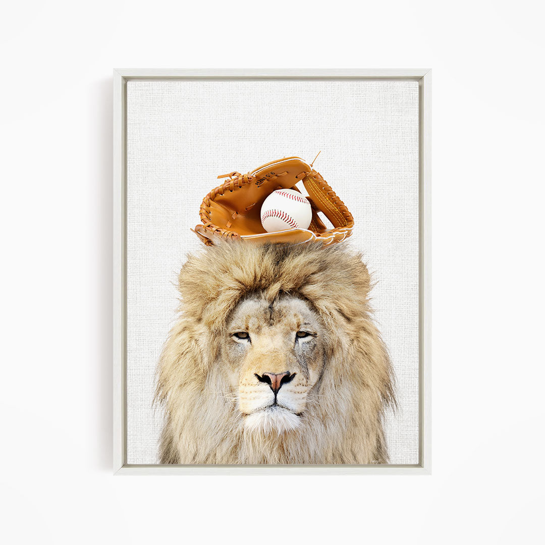 A lion with a baseball glove on its head, with a baseball visible inside the glove.