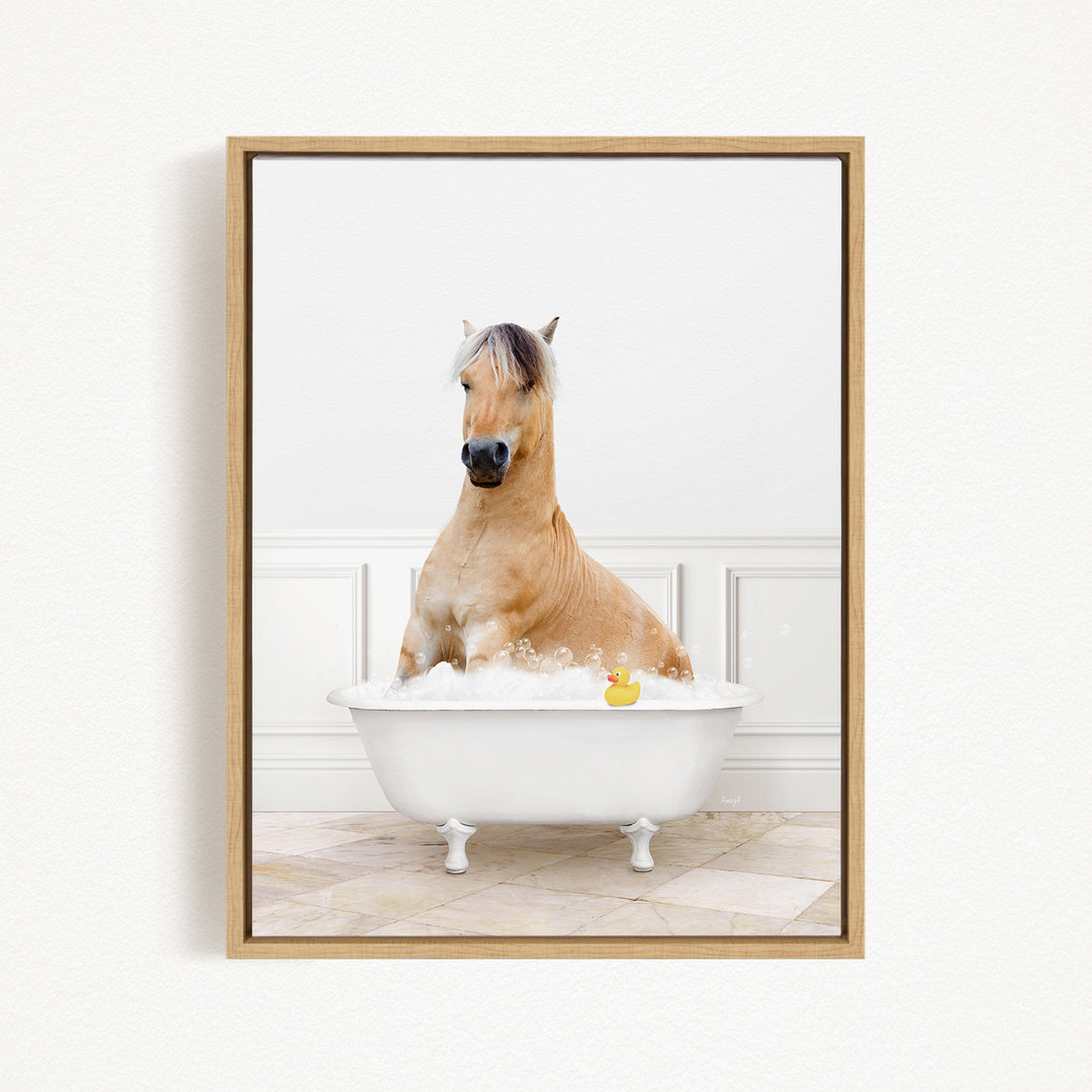 A brown horse is sitting in a white bathtub filled with water, with a rubber duck floating in the water.