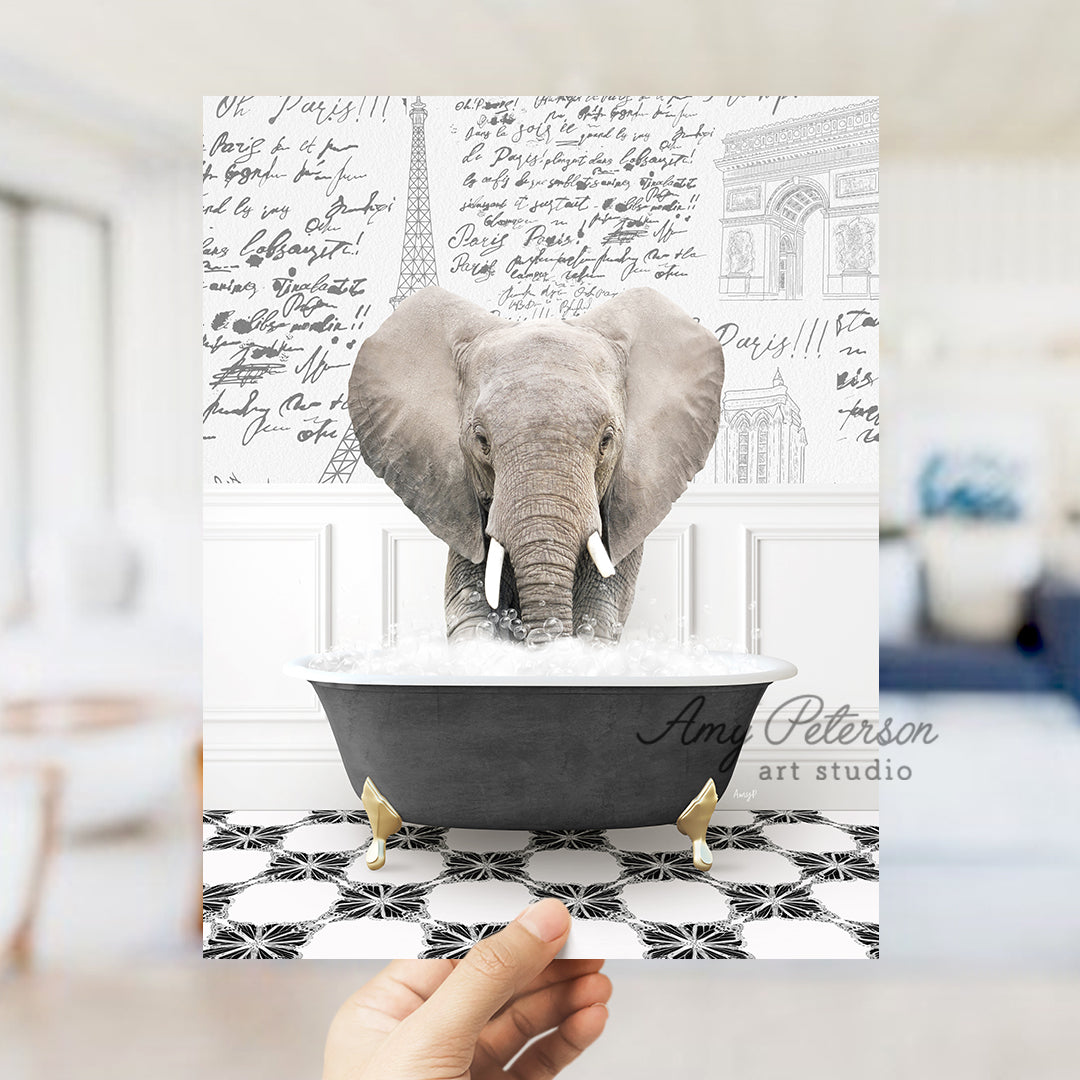 a person holding up a card with an elephant in a bathtub