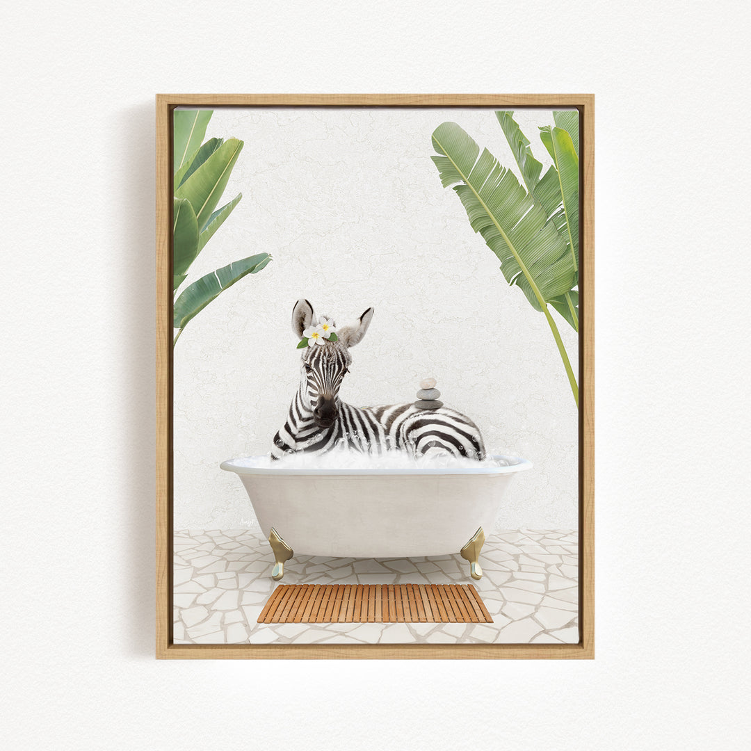 A zebra is sitting in a white bathtub, surrounded by tropical plants and a wooden mat on the floor.