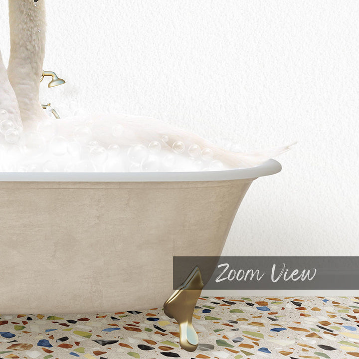 A bathtub filled with bubbles, with a gold faucet and a gold bathtub stopper, set against a white wall with a mosaic floor.