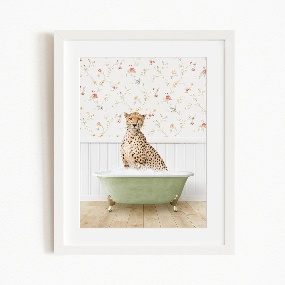 A cheetah sitting in a green bathtub filled with water, with a floral wallpaper in the background.