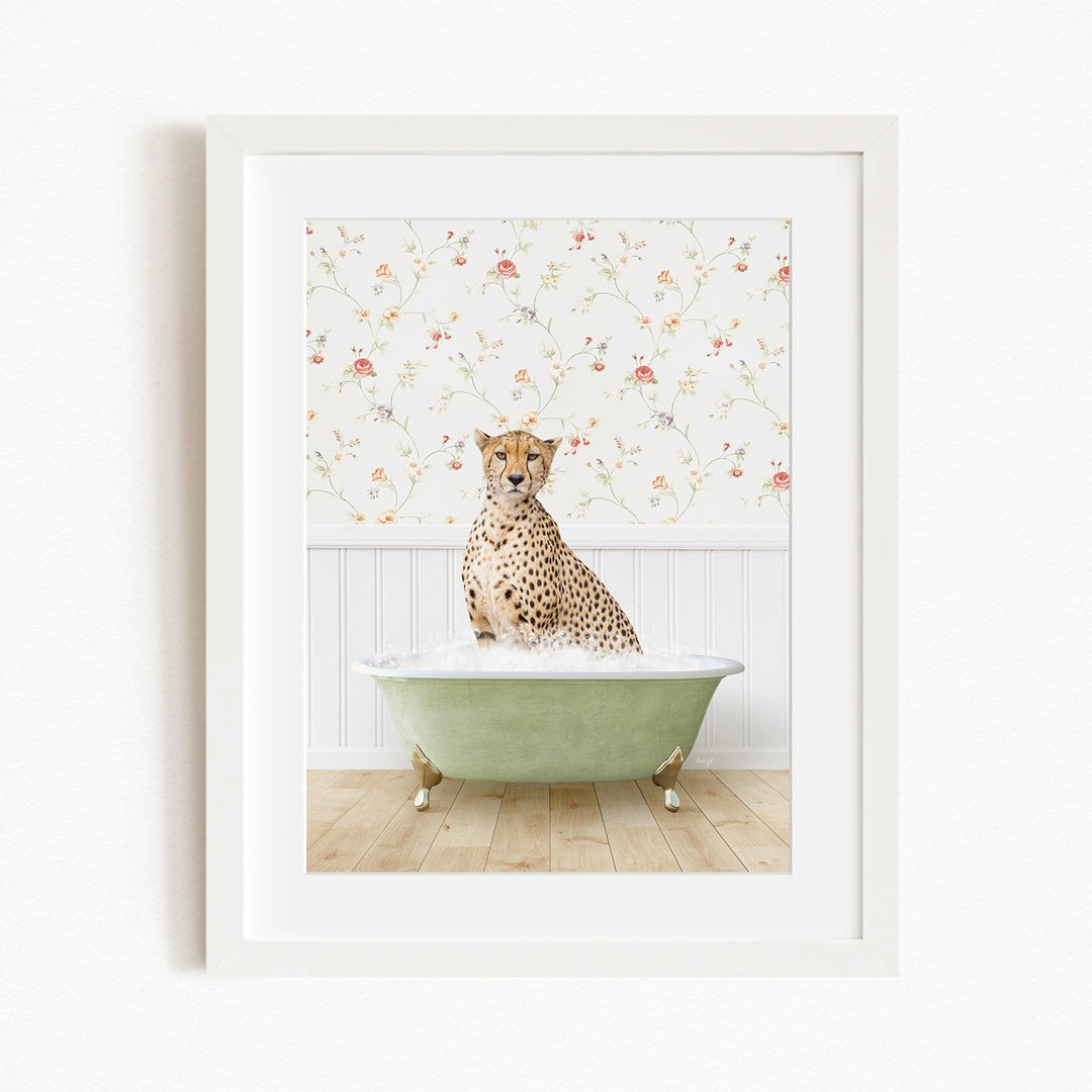 A cheetah sitting in a green bathtub filled with water, with a floral wallpaper in the background.