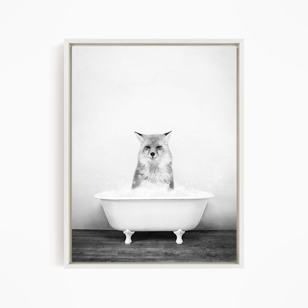 A cat sitting in a white bathtub filled with water, looking directly at the camera.