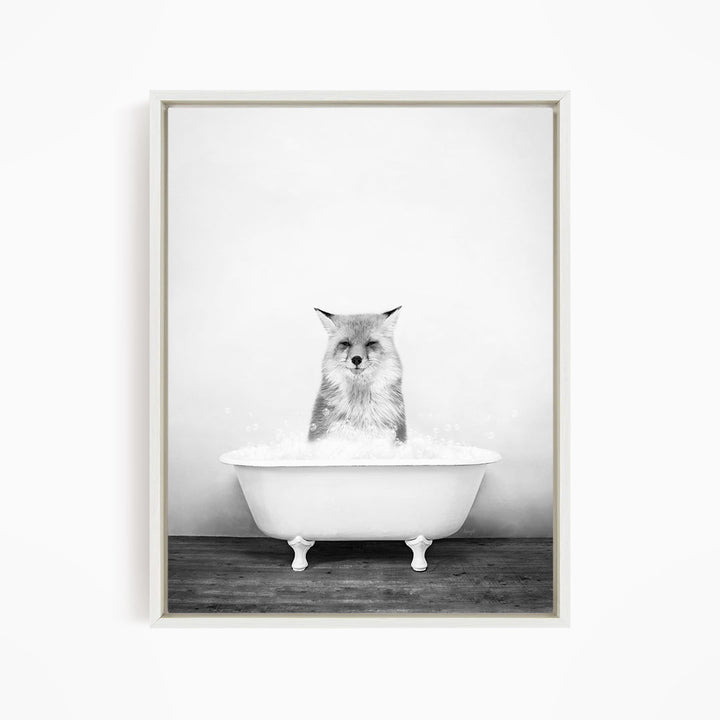 A cat sitting in a white bathtub filled with water, looking directly at the camera.
