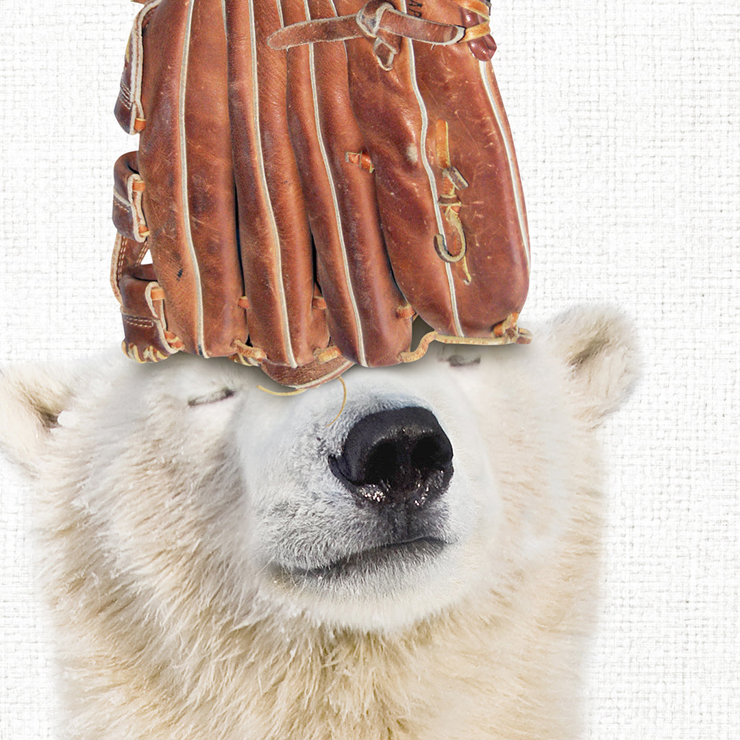 a polar bear with a baseball glove on its head