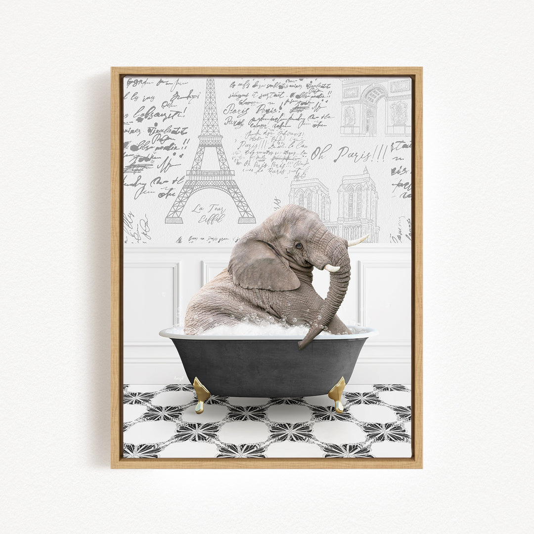 A gray elephant is sitting in a black bathtub, surrounded by a black and white tiled floor and a wall with various inscriptions and drawings.