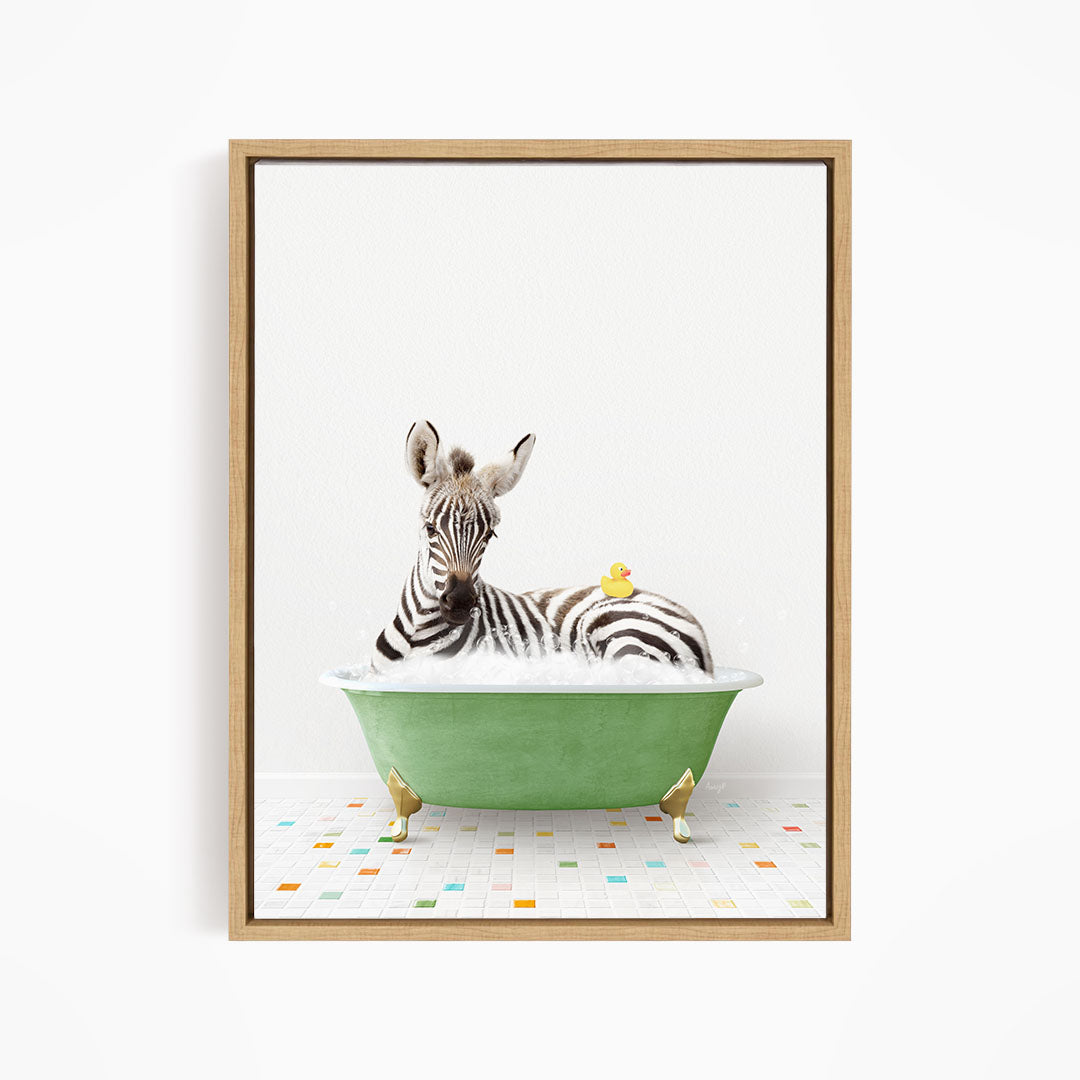 A zebra is sitting in a green bathtub, with a yellow rubber duck resting on its back.