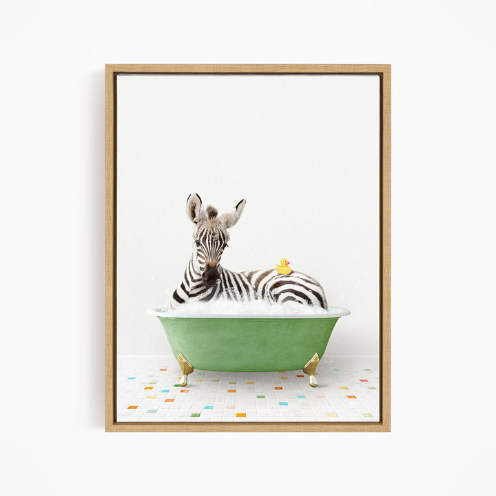 A zebra is sitting in a green bathtub, with a yellow rubber duck resting on its back.