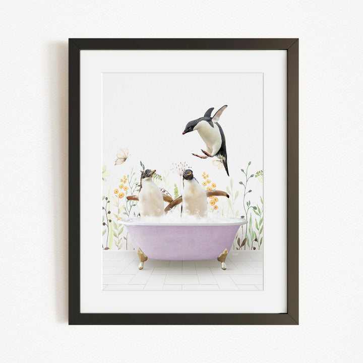 A framed image depicting two penguins sitting in a bathtub, surrounded by flowers and butterflies.