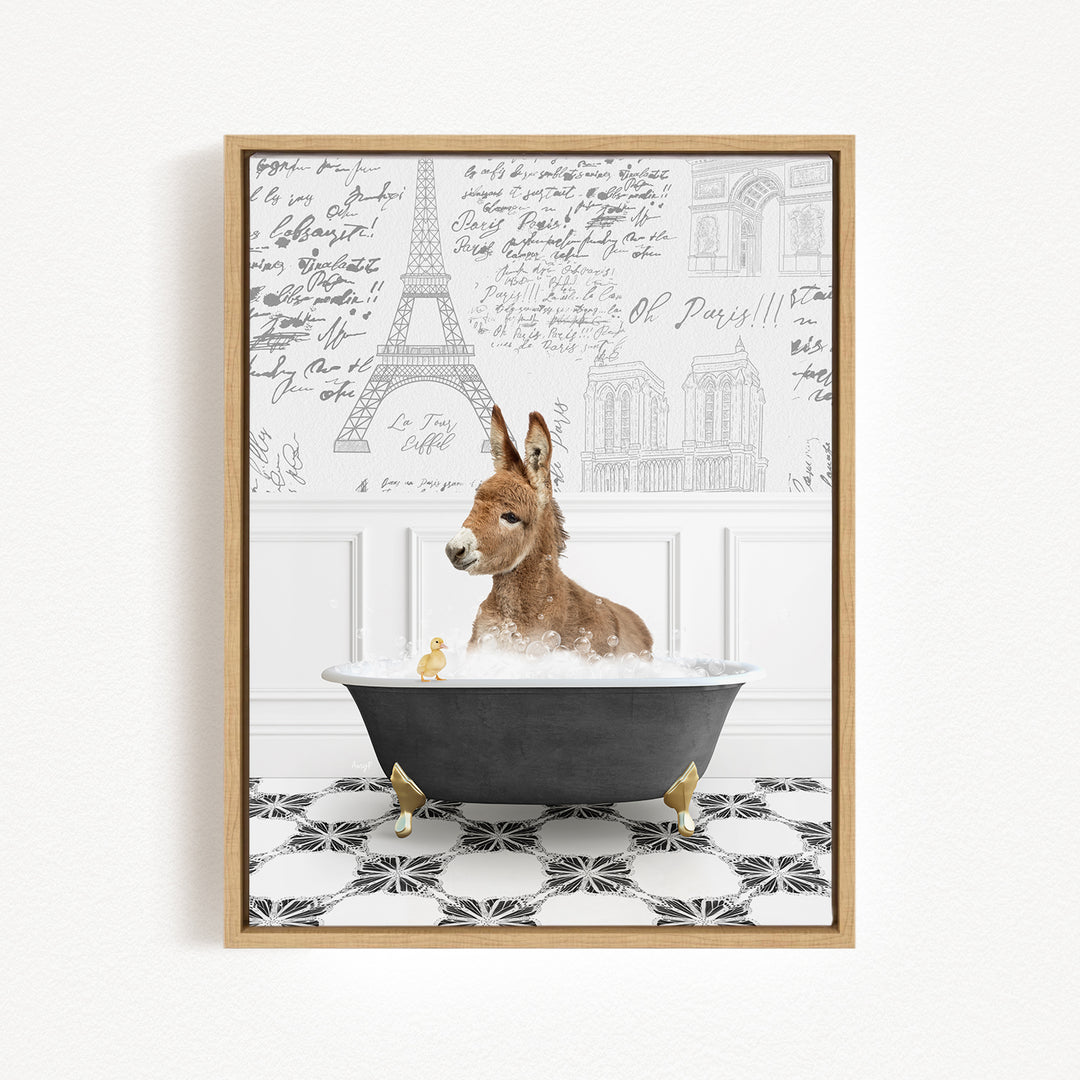 A donkey is sitting in a bathtub filled with water, surrounded by small yellow ducks. The background features the Eiffel Tower and other Parisian architecture.