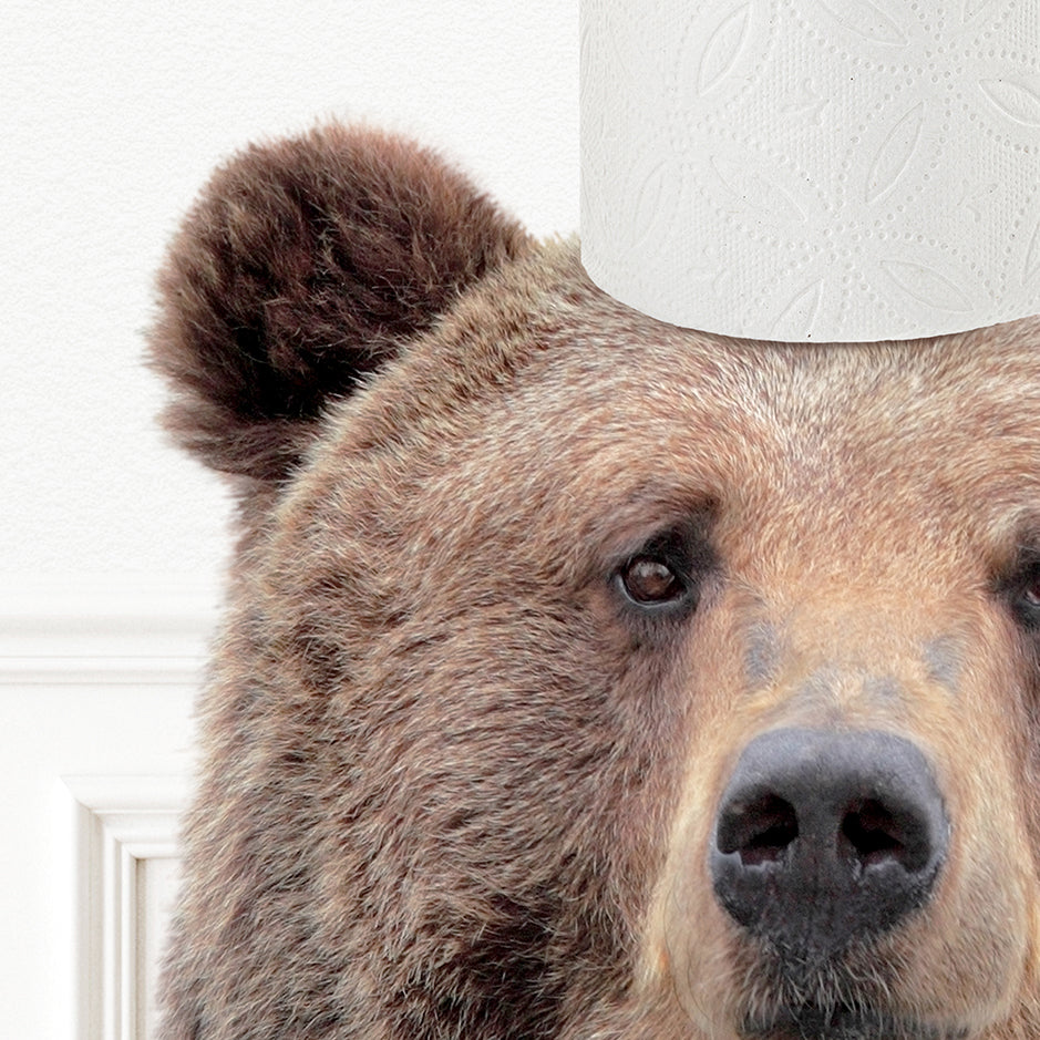 a close up of a bear with a toilet paper on its head