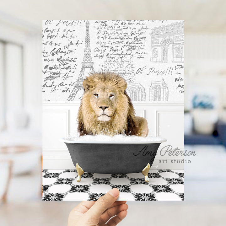 a hand holding a card with a lion in a bathtub