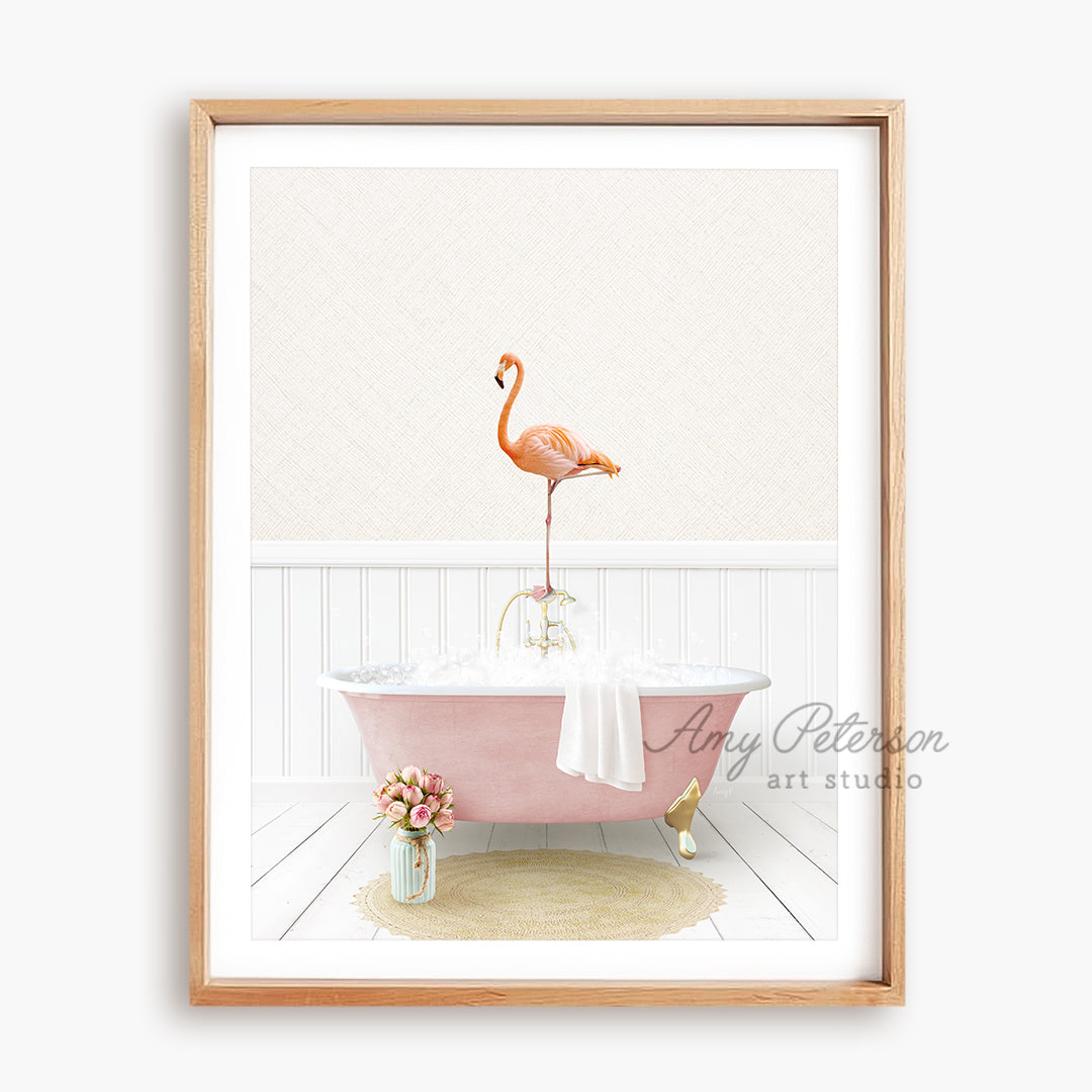 a pink bathtub with a flamingo standing on top of it