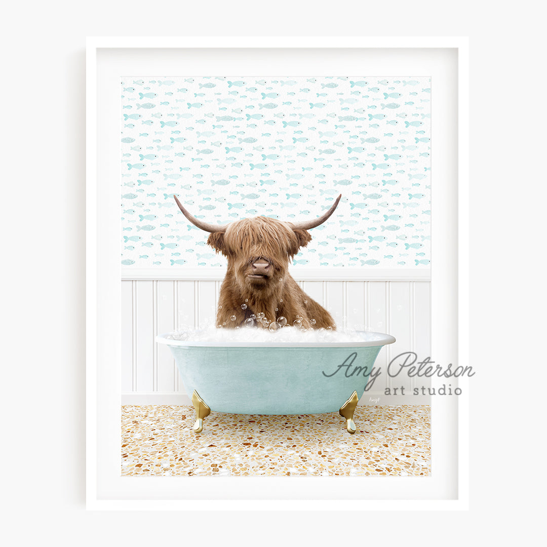 a brown dog sitting in a bathtub with long horns