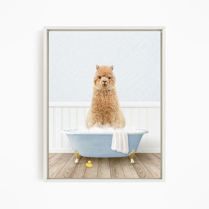 A fluffy brown dog sitting in a blue bathtub filled with bubbles, with a white towel and rubber duck nearby.
