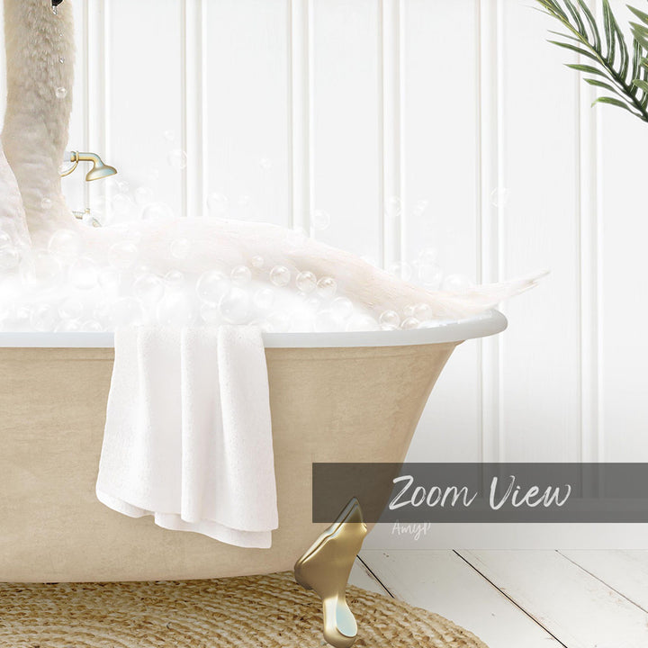 A bathtub filled with bubbles, with a towel hanging on the side and a gold-colored bathtub leg visible.