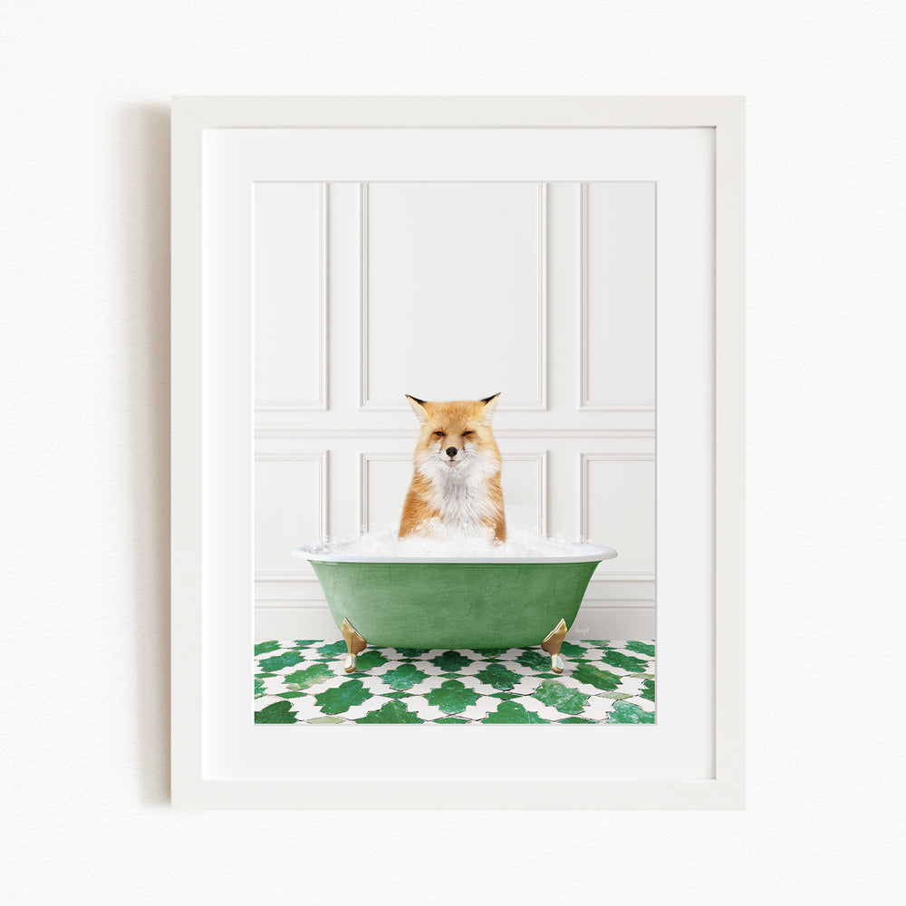 A red fox is sitting in a green bathtub filled with water, with a green and white patterned rug on the floor beneath the tub.