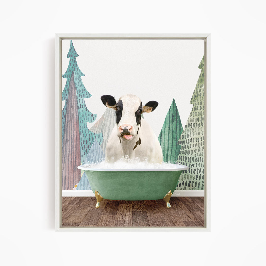 A cow is sitting in a green bathtub filled with water, surrounded by trees with green and brown foliage.