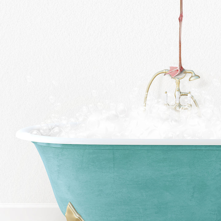 a bathtub filled with white foam and a pink flower