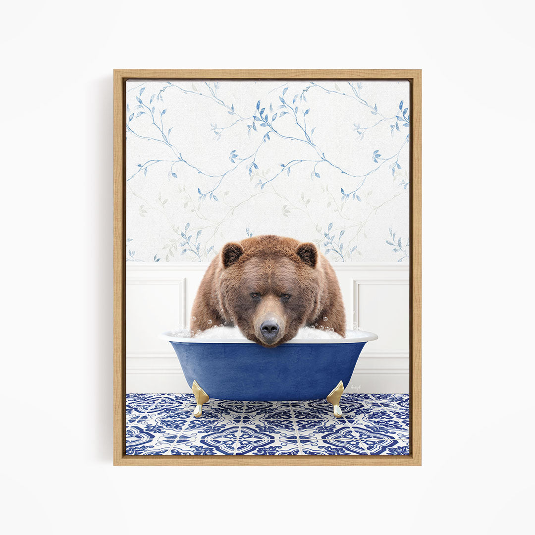 A brown bear is sitting in a blue bathtub, appearing to be enjoying a relaxing bath.