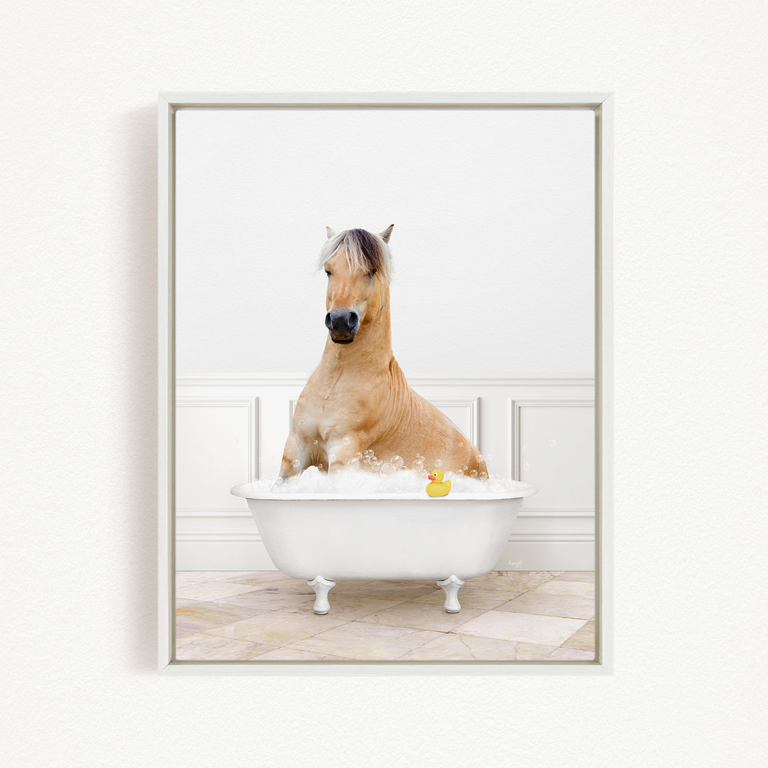 A brown horse sitting in a white bathtub, with a rubber duck floating in the water.