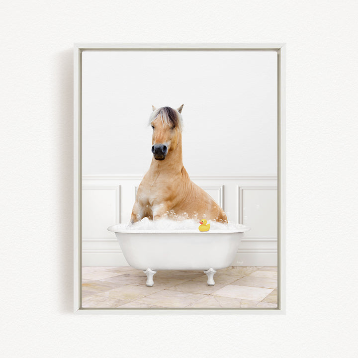 A brown horse sitting in a white bathtub, with a rubber duck floating in the water.