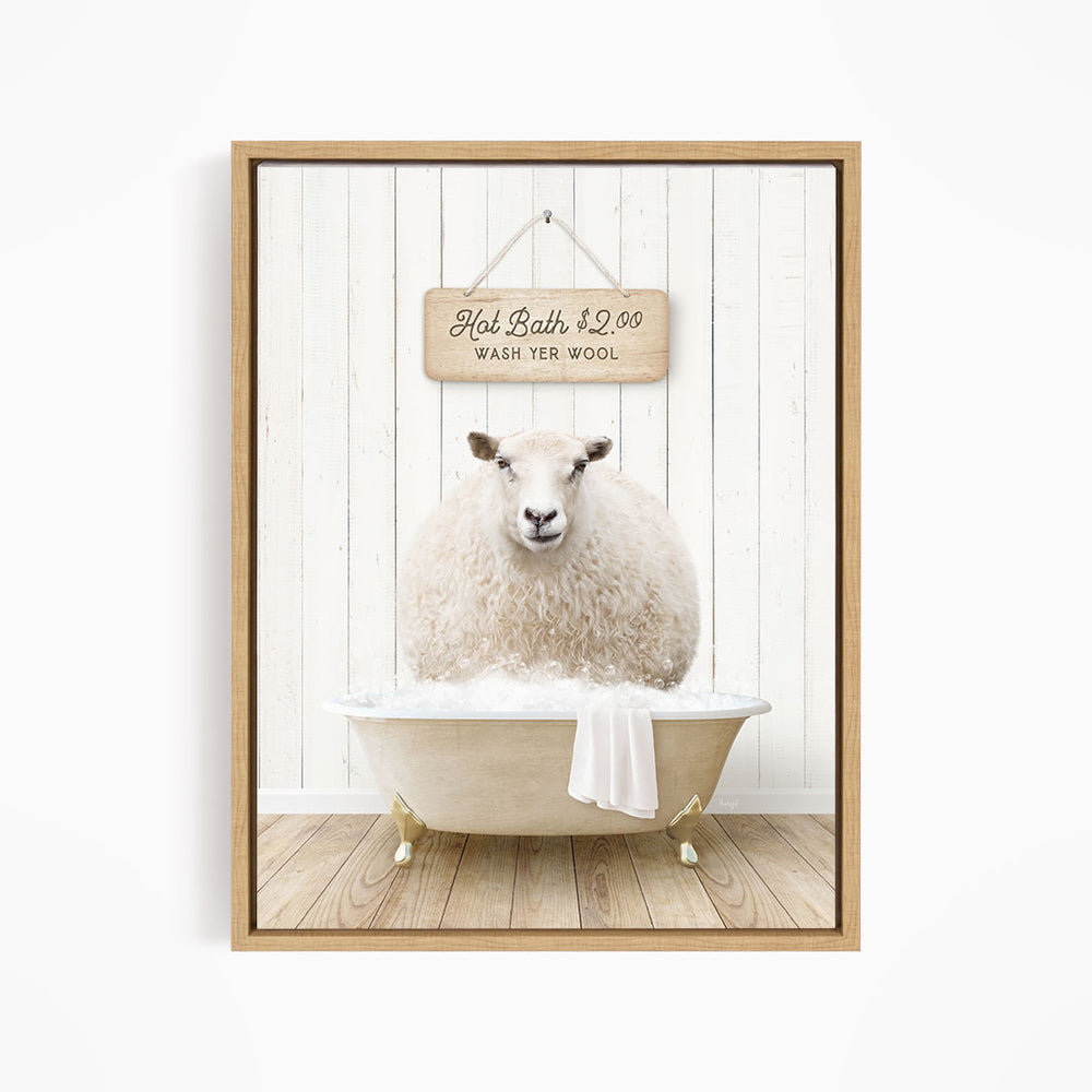 A fluffy white sheep is sitting in a bathtub filled with water, with a wooden sign above it that reads "Hot Bath $2.00 WASH YER WOOL".