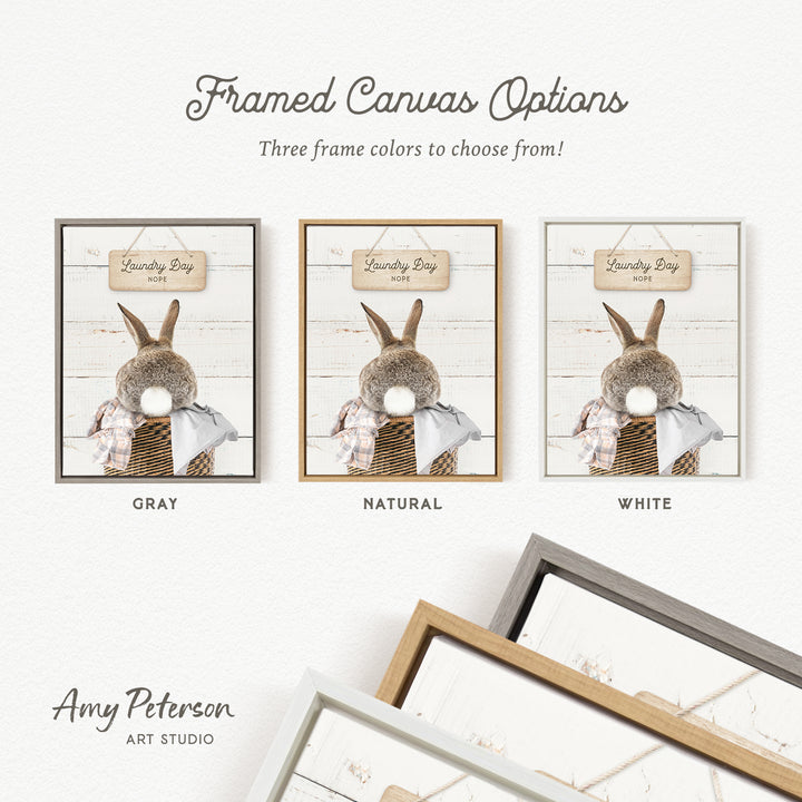 three framed canvas options for a laundry day theme, featuring a rabbit in a basket. The options include a gray frame, a natural frame, and a white frame.