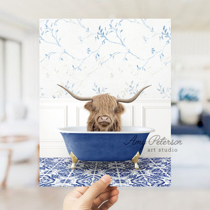 a person holding a card with a picture of a bull in a bathtub