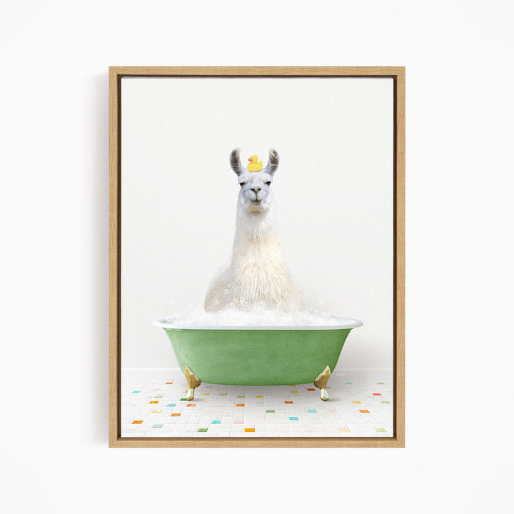 A white llama sitting in a green bathtub filled with bubbles, with a yellow rubber duck floating on its head.