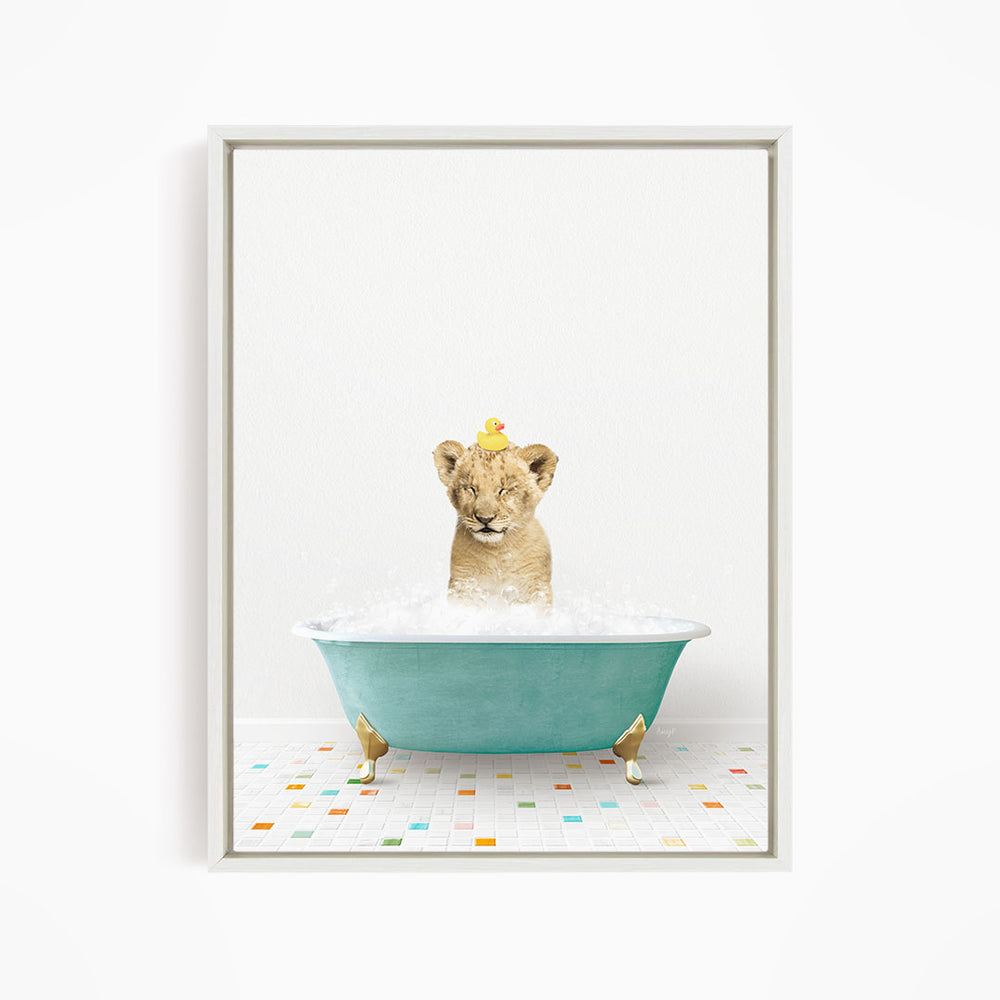 A young lion cub is sitting in a blue bathtub filled with water, surrounded by colorful tiles on the floor.