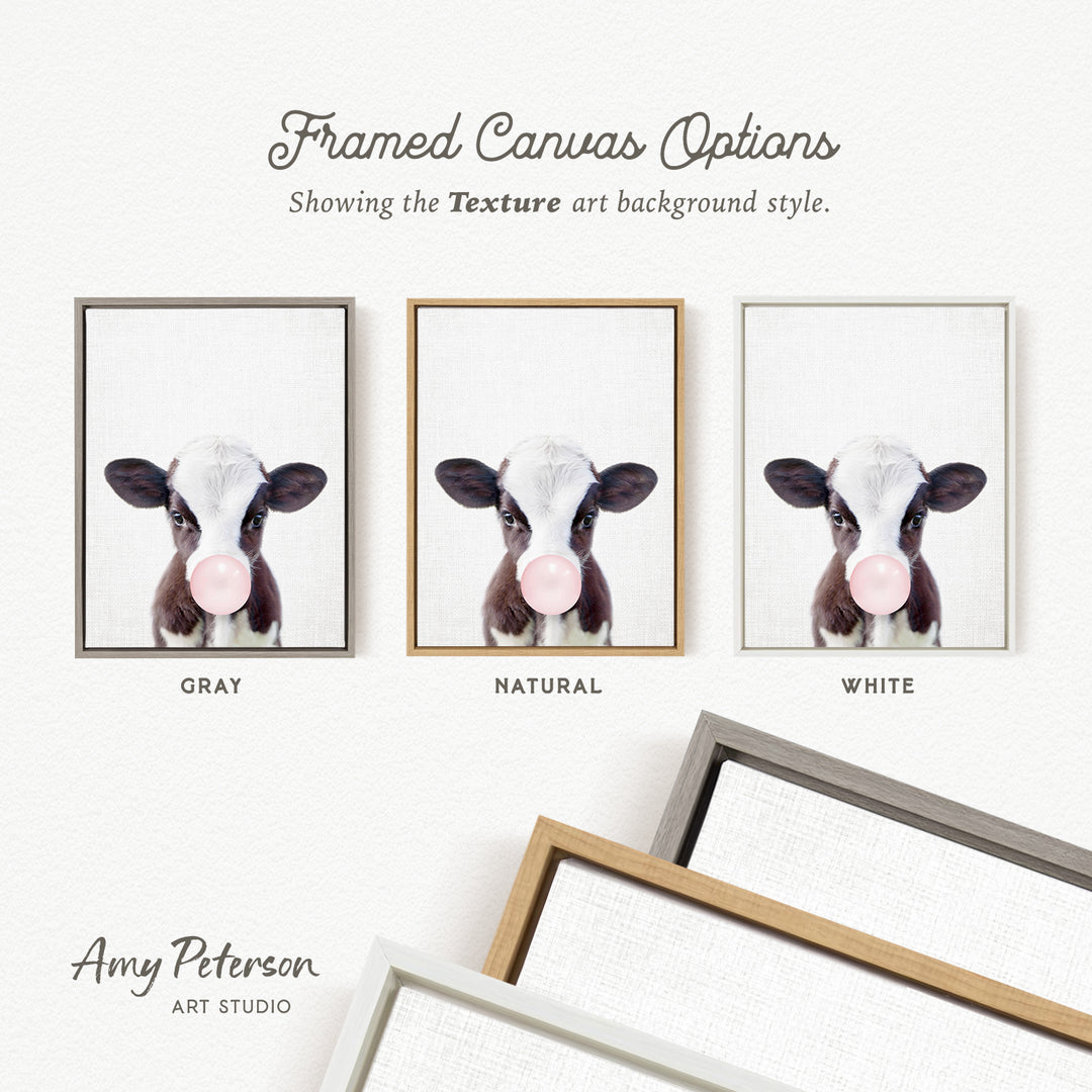 three framed canvas options, each featuring a close-up of a cow's face with a pink bubble gum bubble. The options are labeled "GRAY", "NATURAL", and "WHITE".