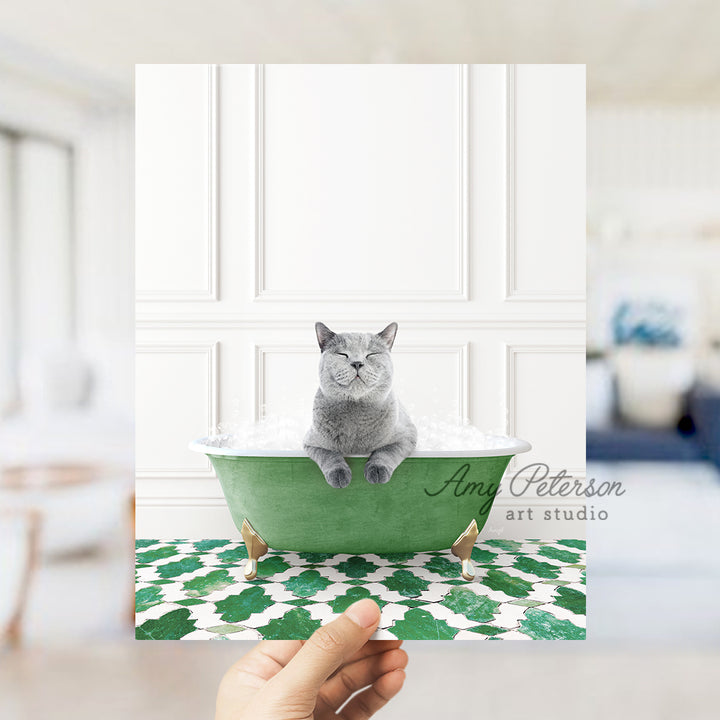 a person holding a card with a cat in a bathtub